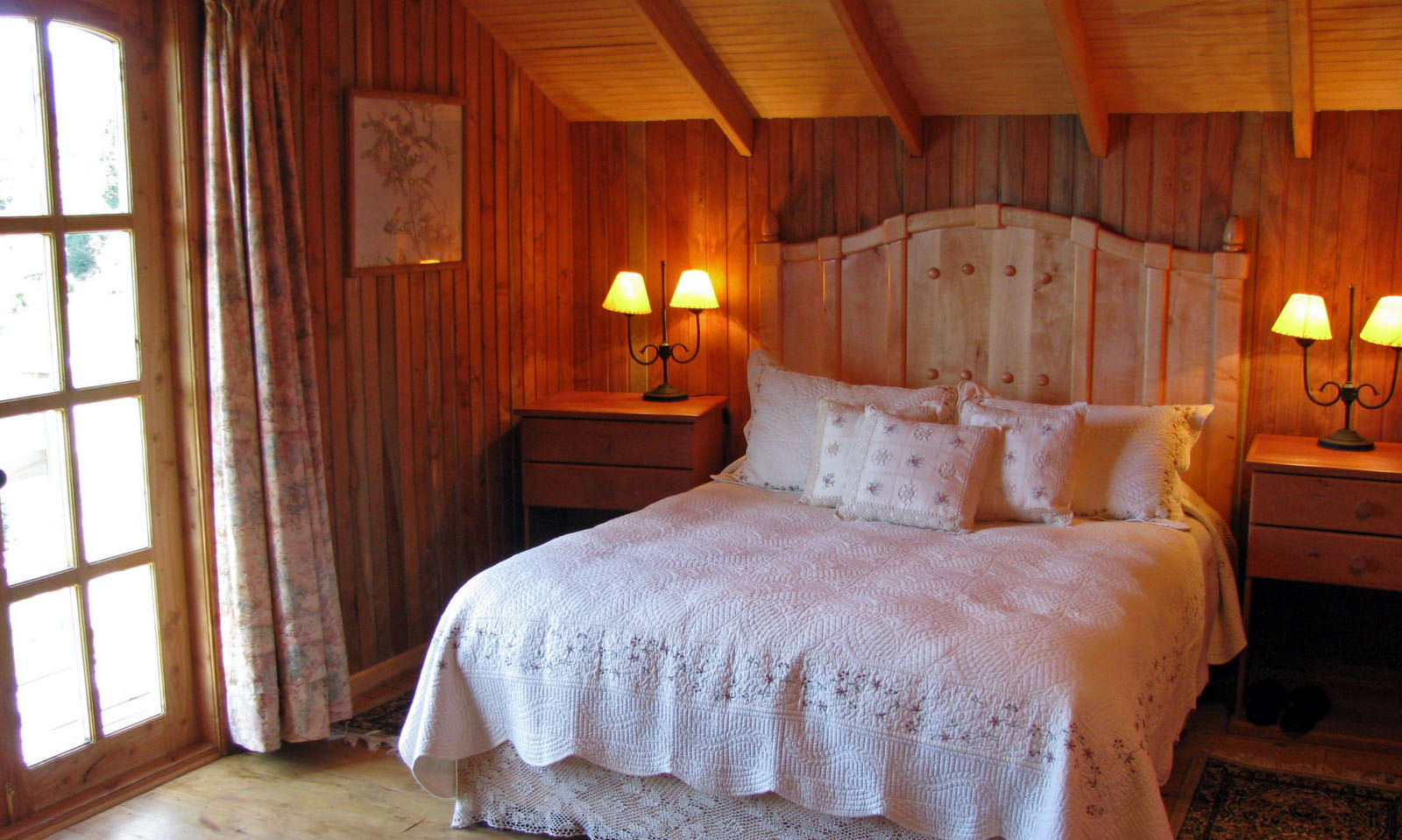 This is one of 2 similar bedrooms at the lodge with a queen size bed as seen in the photo, another twin bed, and a private bath ensuite.